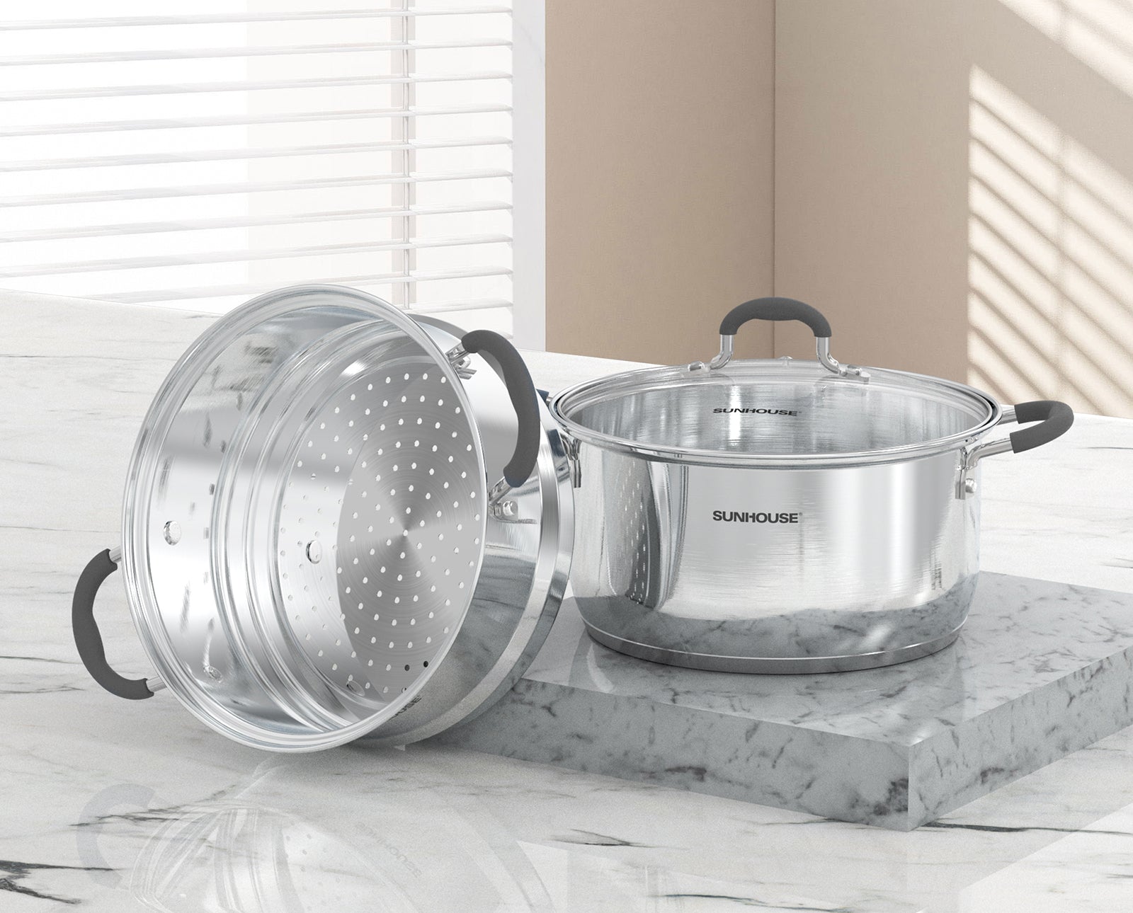 Sunhouse Stainless steel cookware set with lid and steamer insert on a marble surface.